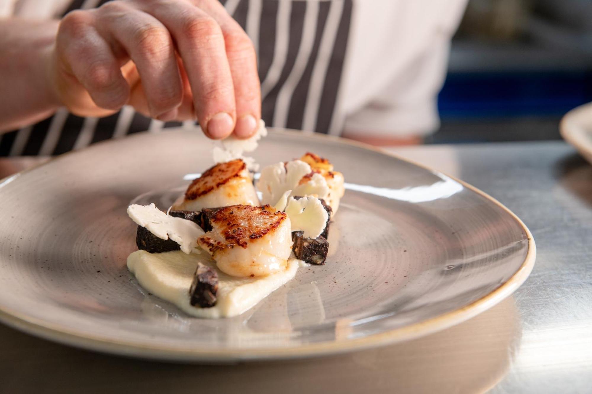 The Millstone, Mellor Hotel Blackburn  Exterior photo A chef finishing a plate of scallops