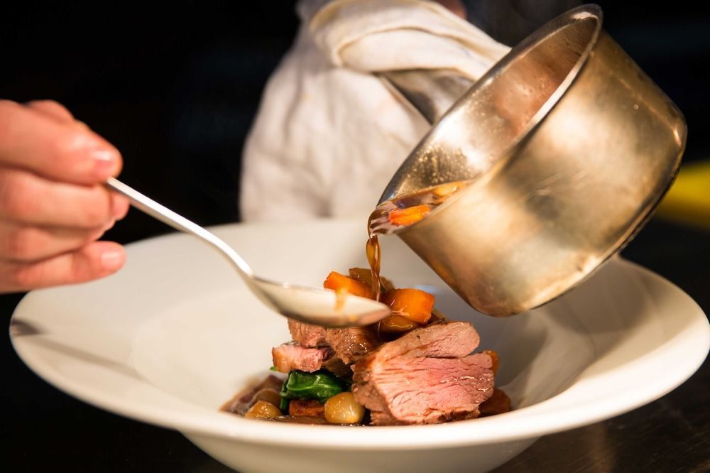 The Millstone, Mellor Hotel Blackburn  Exterior photo A chef plating a dish